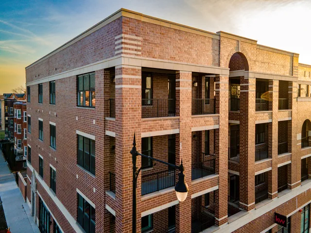 a front view of a building with a large windows