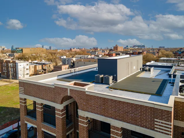 an aerial view of residential houses with outdoor space