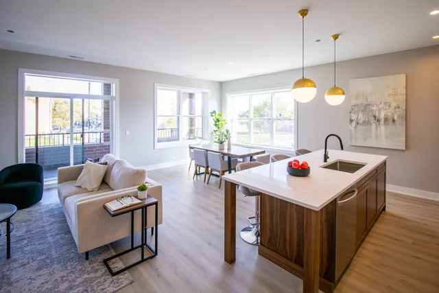 a living room with furniture and a table