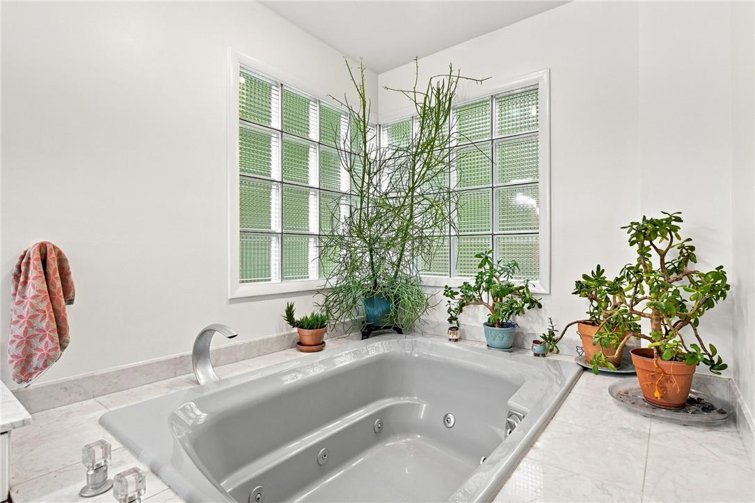 3408 Oak Hill Road Emmaus, PA 18049 - Photo 27 of 93 Natural light filters through privacy glass windows directly above the deep soaking tub.
