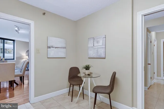 a view of a workspace with furniture and a potted plant