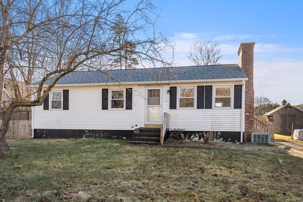 4 Meadow Lane Three Rivers, MA 01080 - Photo 1 of 23 a large house with a yard and trees in front of it