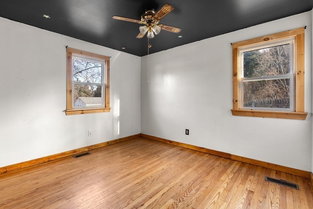 4 Meadow Lane Three Rivers, MA 01080 - Photo 16 of 23 a view of an empty room with a window and wooden floor