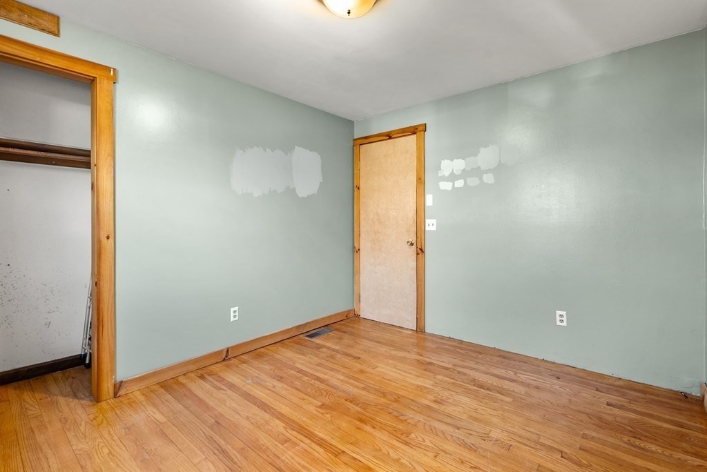 4 Meadow Lane Three Rivers, MA 01080 - Photo 19 of 23 an empty room with wooden floor and windows