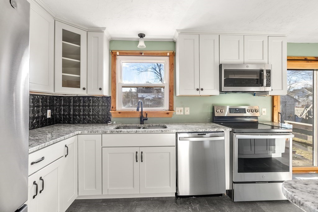 4 Meadow Lane Three Rivers, MA 01080 - Photo 4 of 23 a kitchen with granite countertop white cabinets and white appliances