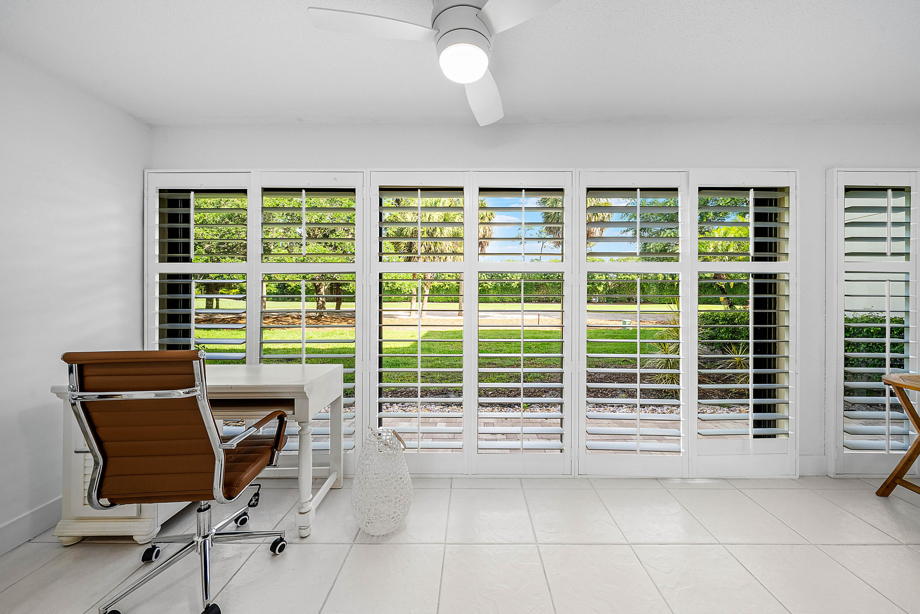 4249 North Quail Ridge Drive, Unit A Boynton Beach, FL 33436 - Photo 13 of 49 a view of a workspace with furniture and a window