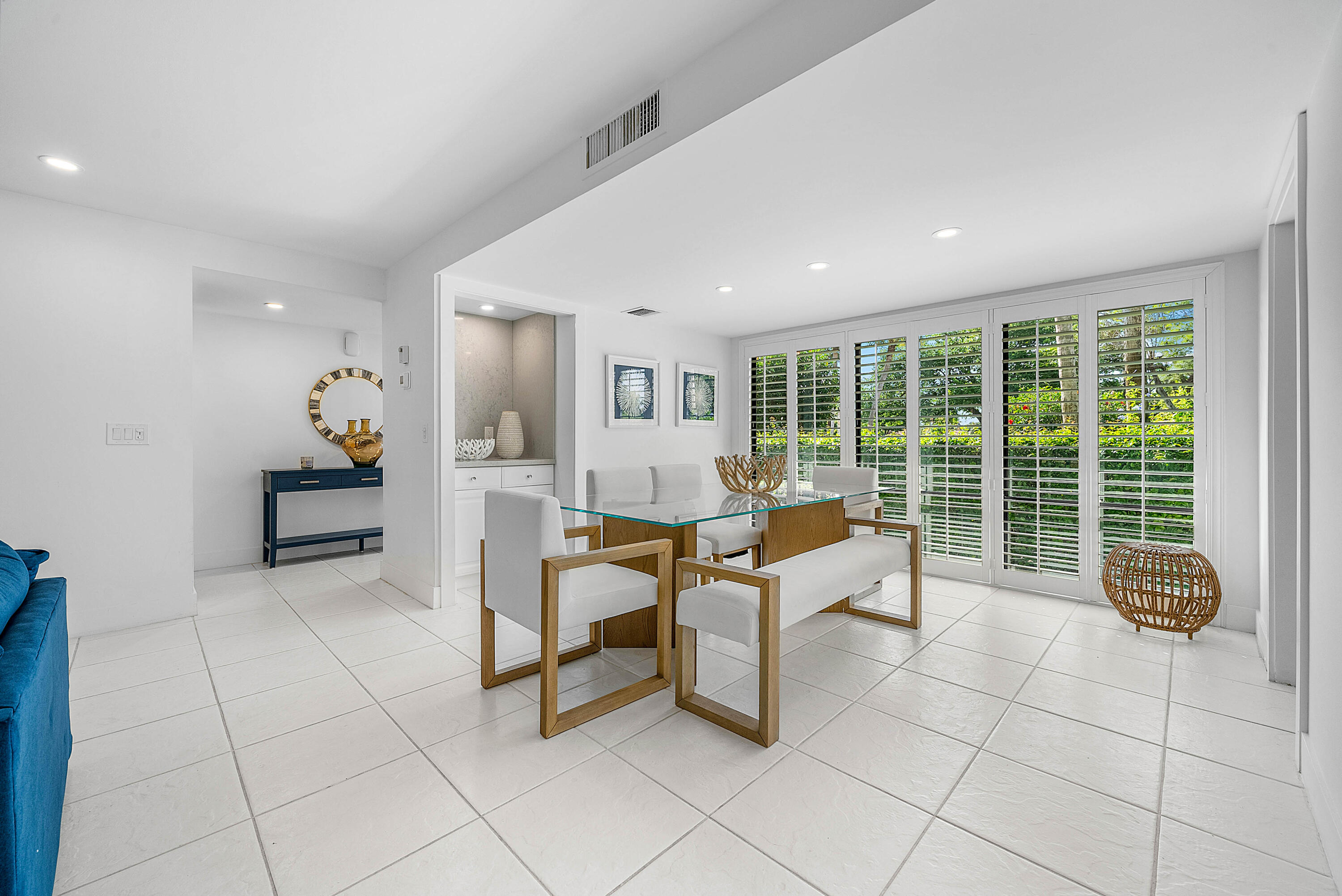 4249 North Quail Ridge Drive, Unit A Boynton Beach, FL 33436 - Photo 14 of 49 a living room with furniture and large windows