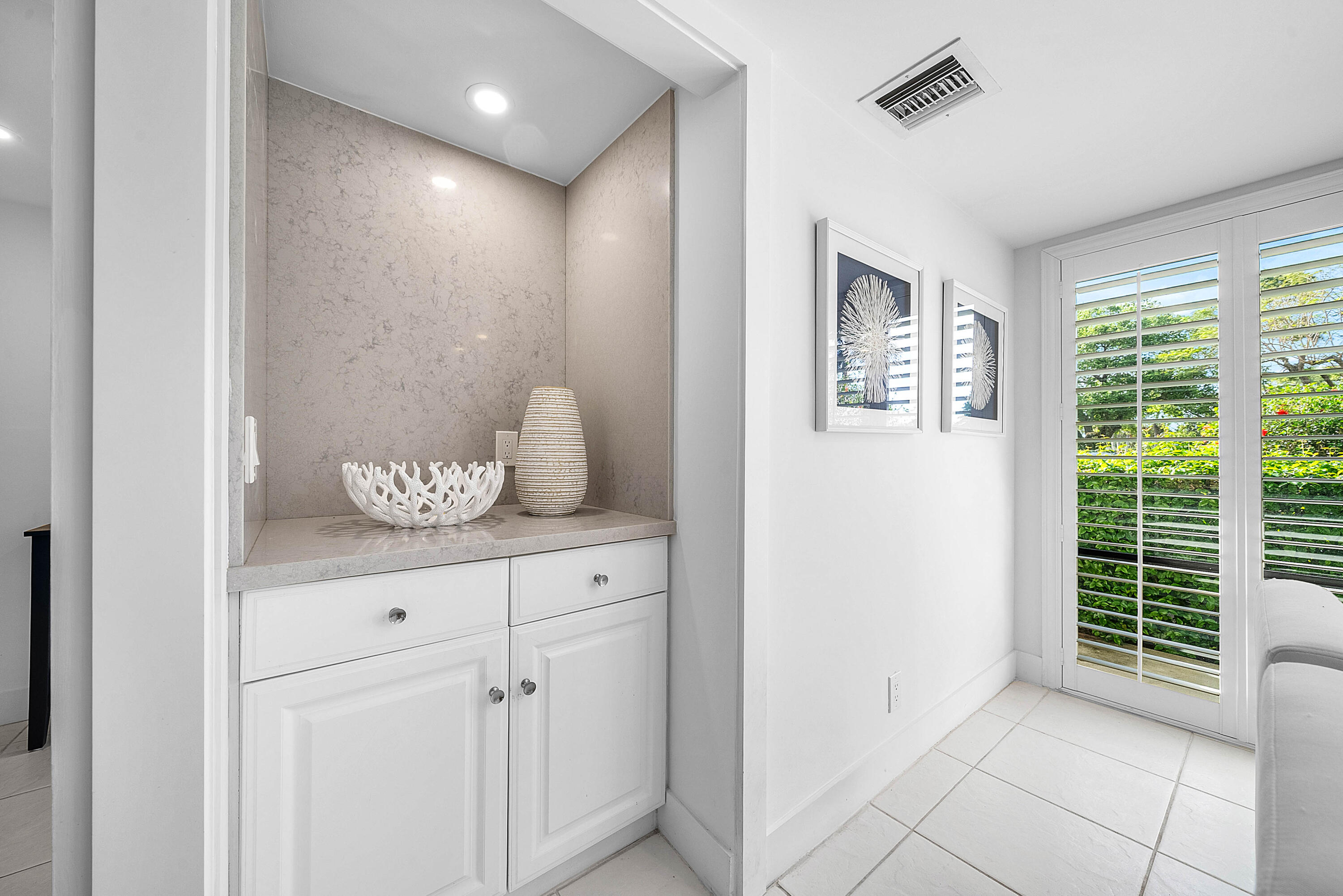 4249 North Quail Ridge Drive, Unit A Boynton Beach, FL 33436 - Photo 16 of 49 a view of room with window and cabinet