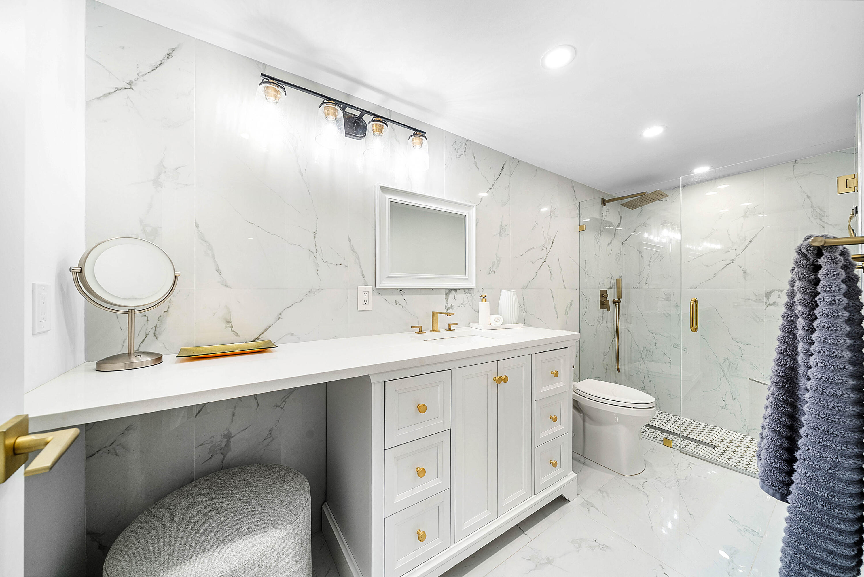 4249 North Quail Ridge Drive, Unit A Boynton Beach, FL 33436 - Photo 23 of 49 a bathroom with a double vanity sink toilet and a mirror