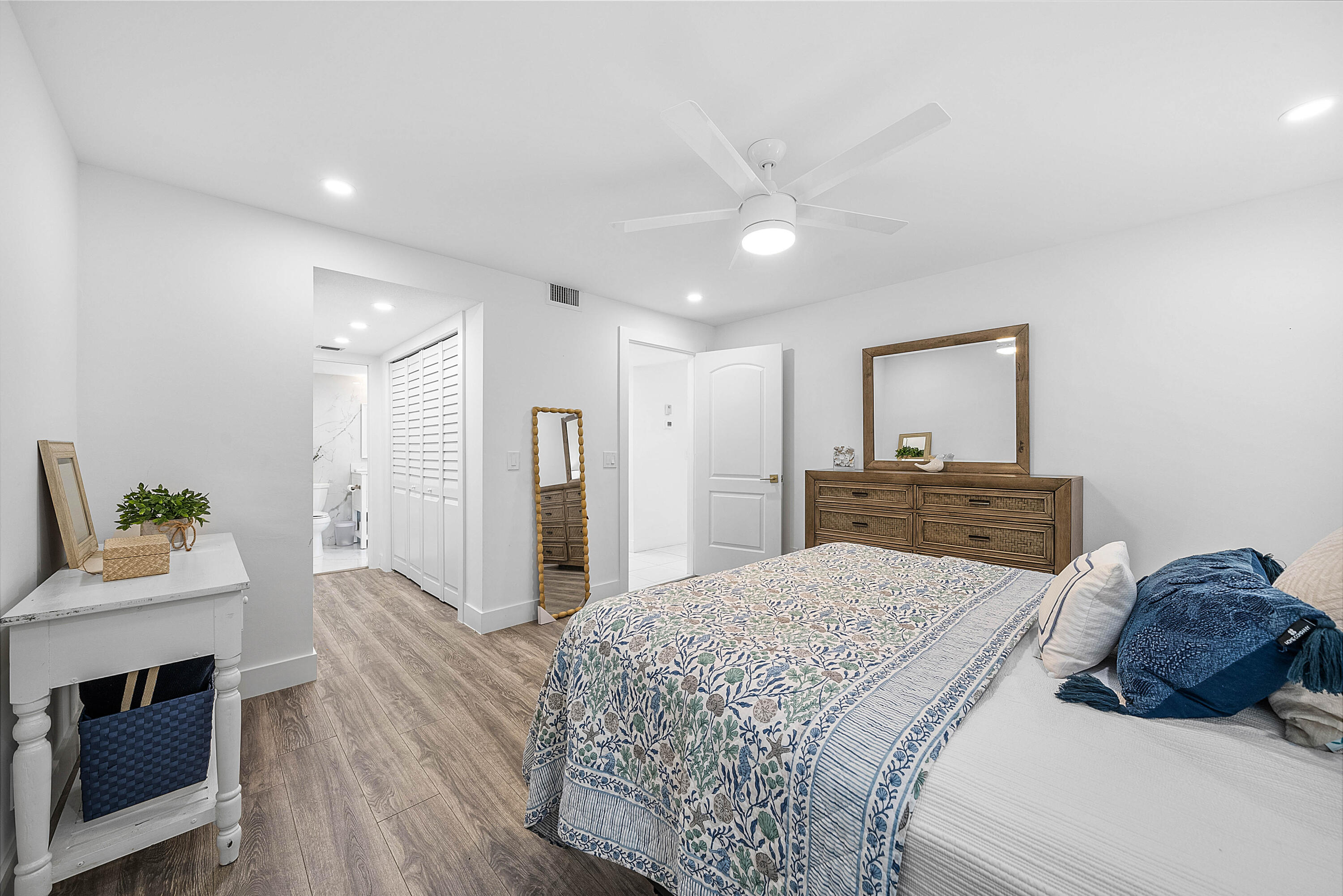4249 North Quail Ridge Drive, Unit A Boynton Beach, FL 33436 - Photo 27 of 49 a bedroom with a bed and a dresser