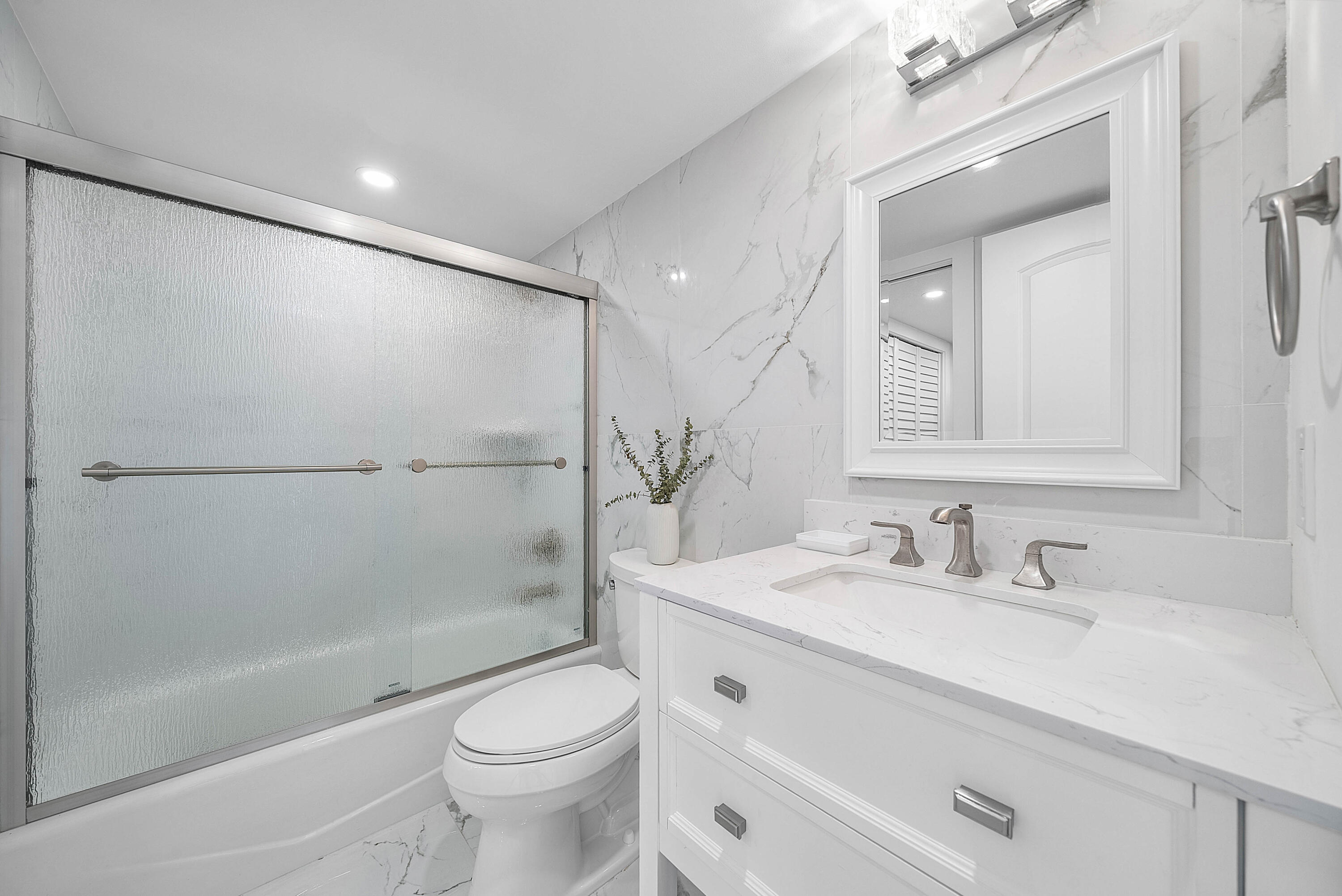4249 North Quail Ridge Drive, Unit A Boynton Beach, FL 33436 - Photo 28 of 49 a bathroom with a sink a toilet and shower