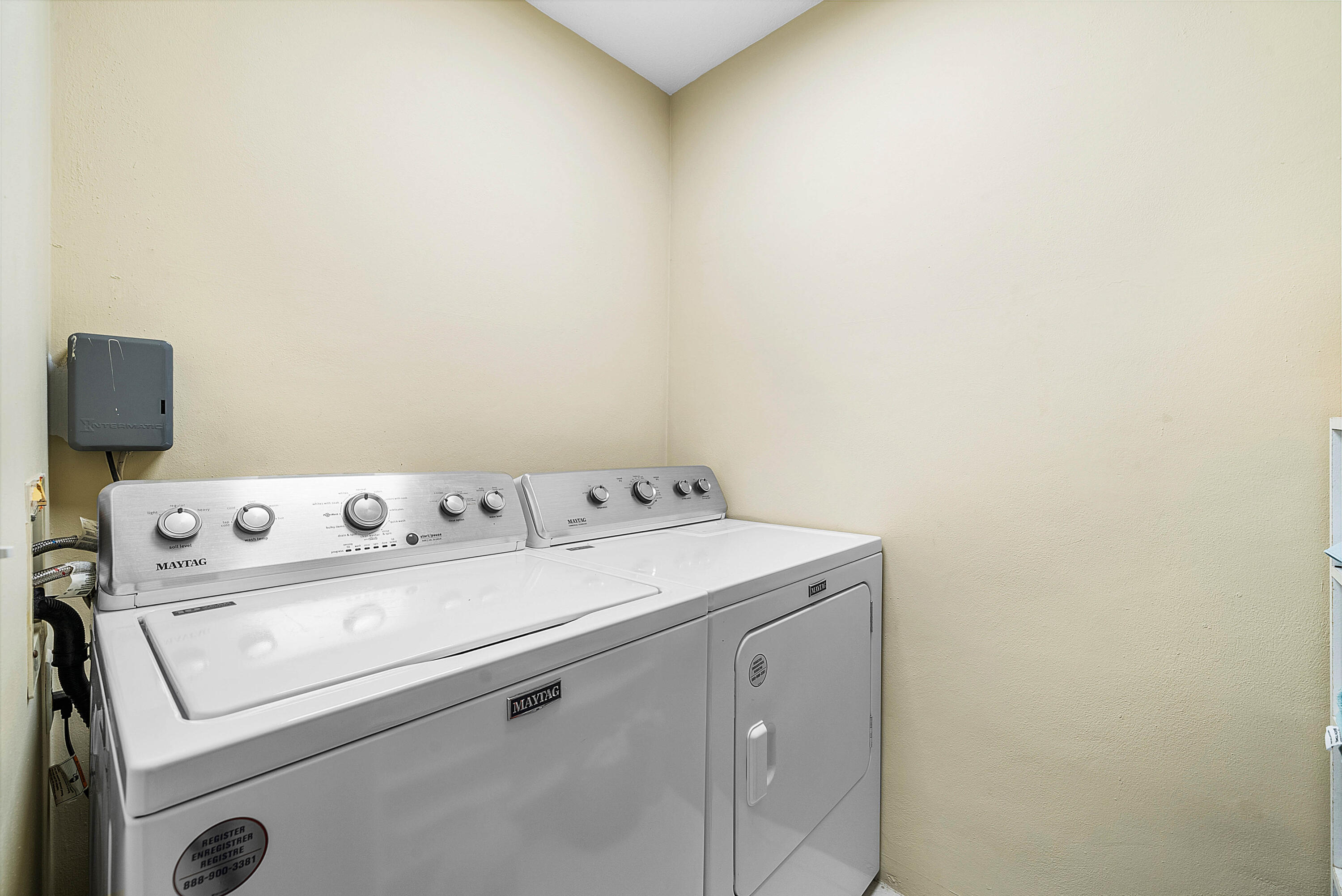 4249 North Quail Ridge Drive, Unit A Boynton Beach, FL 33436 - Photo 30 of 49 a utility room with dryer and washer