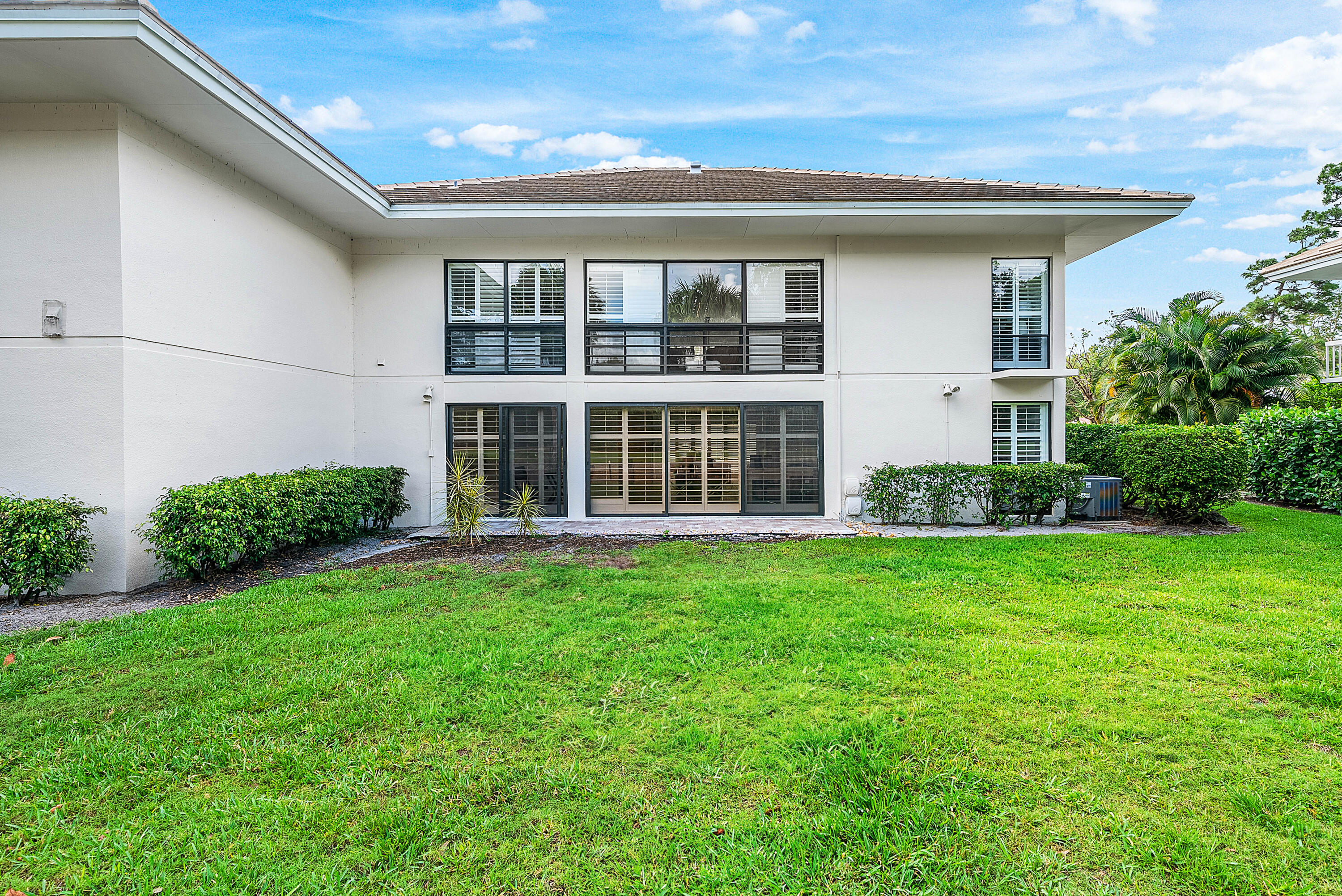 4249 North Quail Ridge Drive, Unit A Boynton Beach, FL 33436 - Photo 33 of 49 a view of an house with backyard space and balcony