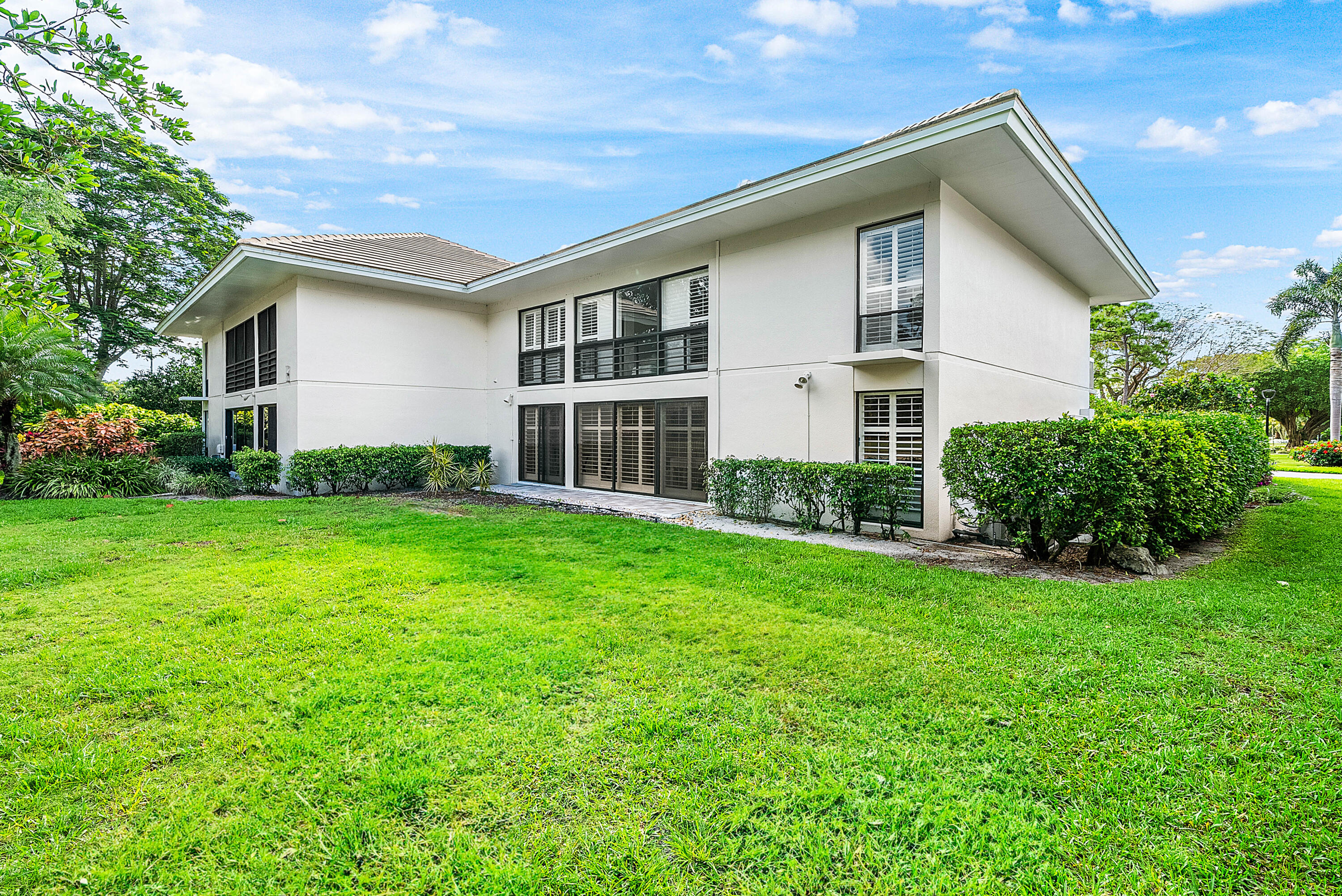 4249 North Quail Ridge Drive, Unit A Boynton Beach, FL 33436 - Photo 35 of 49 a house view with a garden space