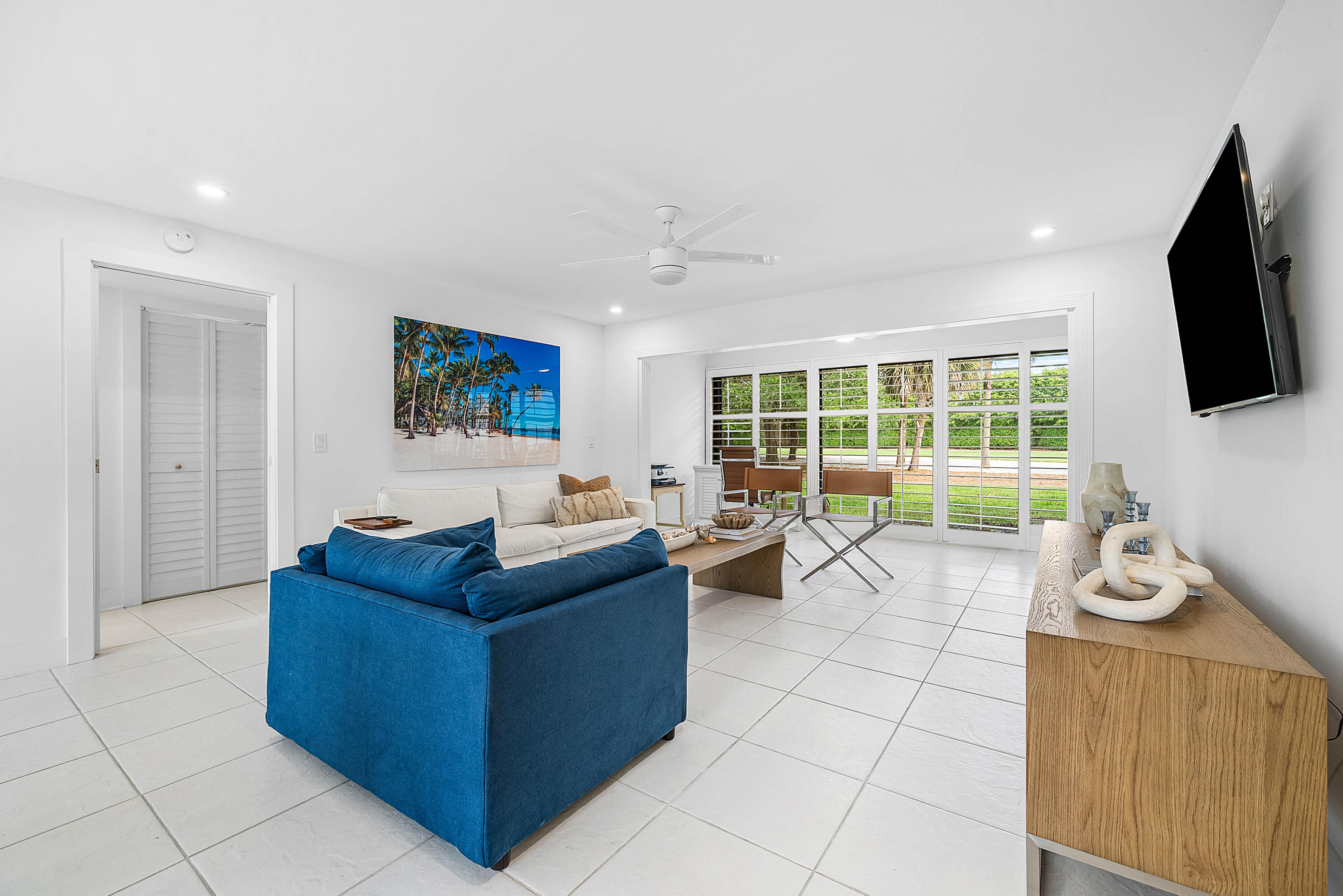 4249 North Quail Ridge Drive, Unit A Boynton Beach, FL 33436 - Photo 7 of 49 a living room with furniture and a flat screen tv