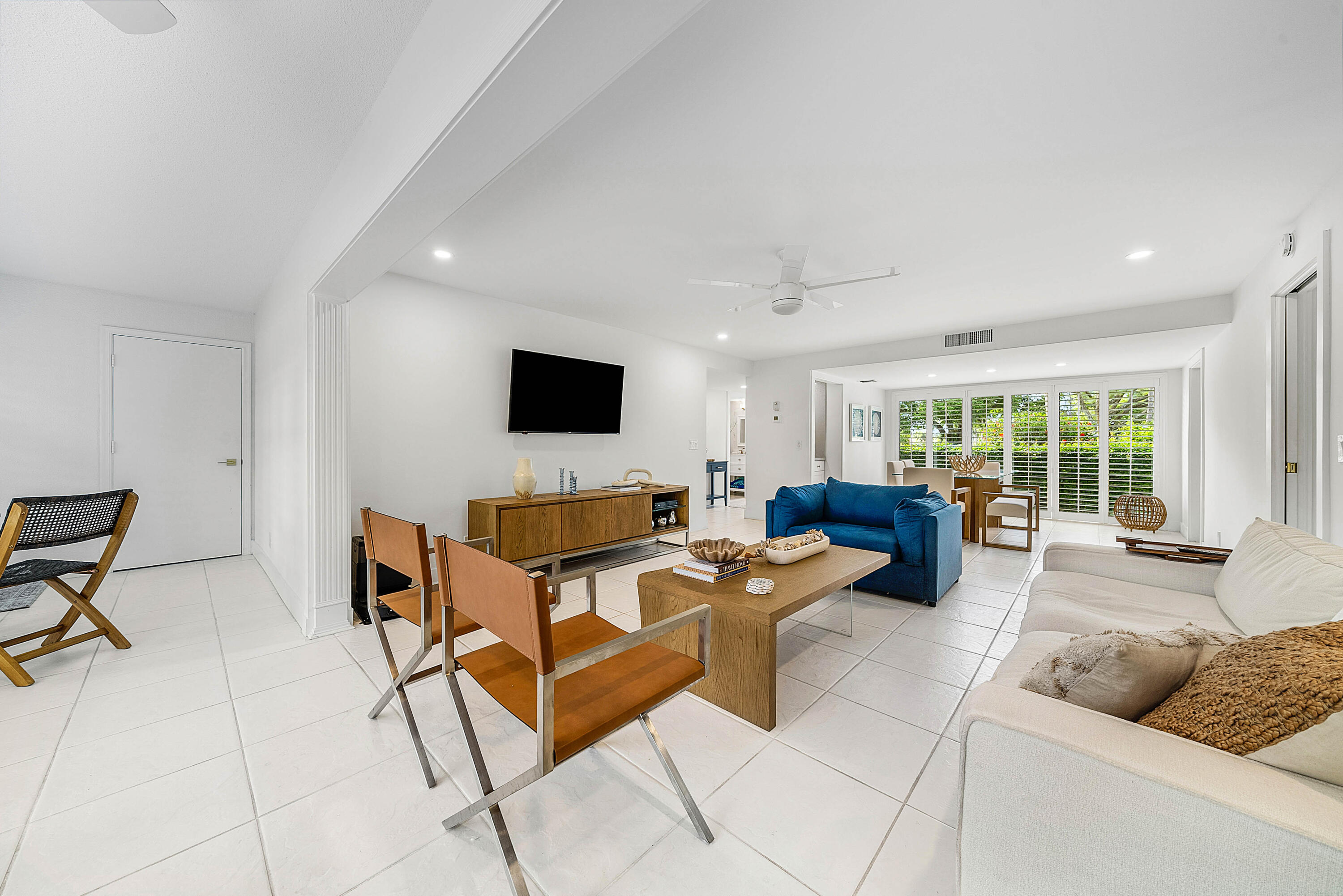 4249 North Quail Ridge Drive, Unit A Boynton Beach, FL 33436 - Photo 9 of 49 a living room with furniture and a flat screen tv