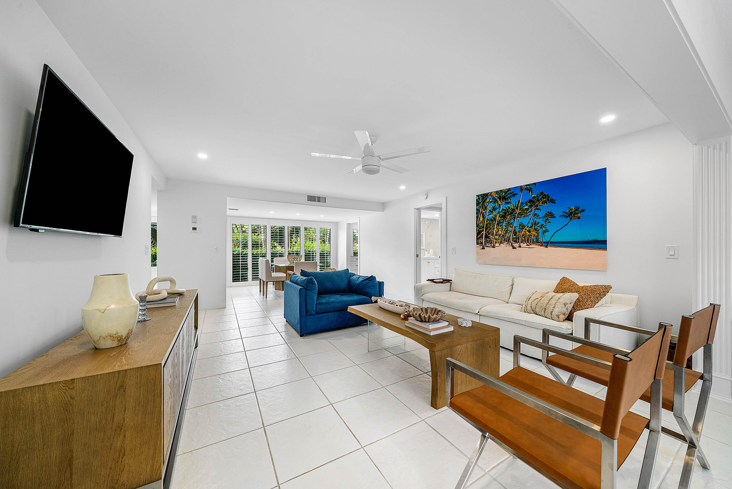 4249 North Quail Ridge Drive, Unit A Boynton Beach, FL 33436 - Photo 10 of 49 a living room with furniture and a flat screen tv
