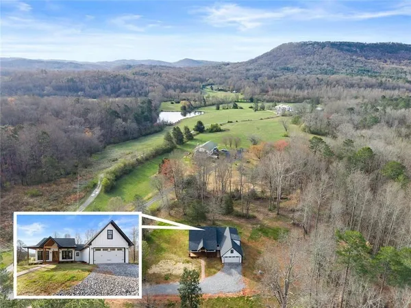 a view of houses with outdoor space and swimming pool