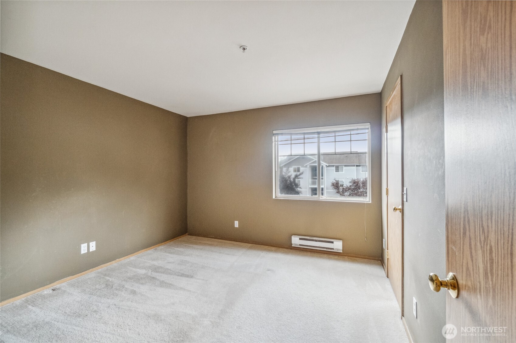 15150 140th Way Southeast, Unit T304 Renton, WA 98058 - Photo 12 of 30 a view of an empty room with a window