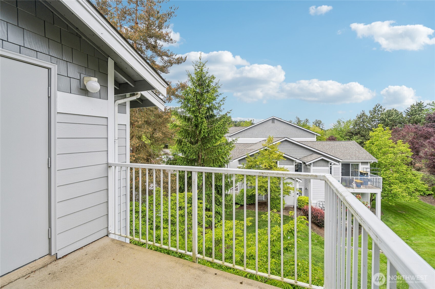 15150 140th Way Southeast, Unit T304 Renton, WA 98058 - Photo 17 of 30 a view of a house with a balcony