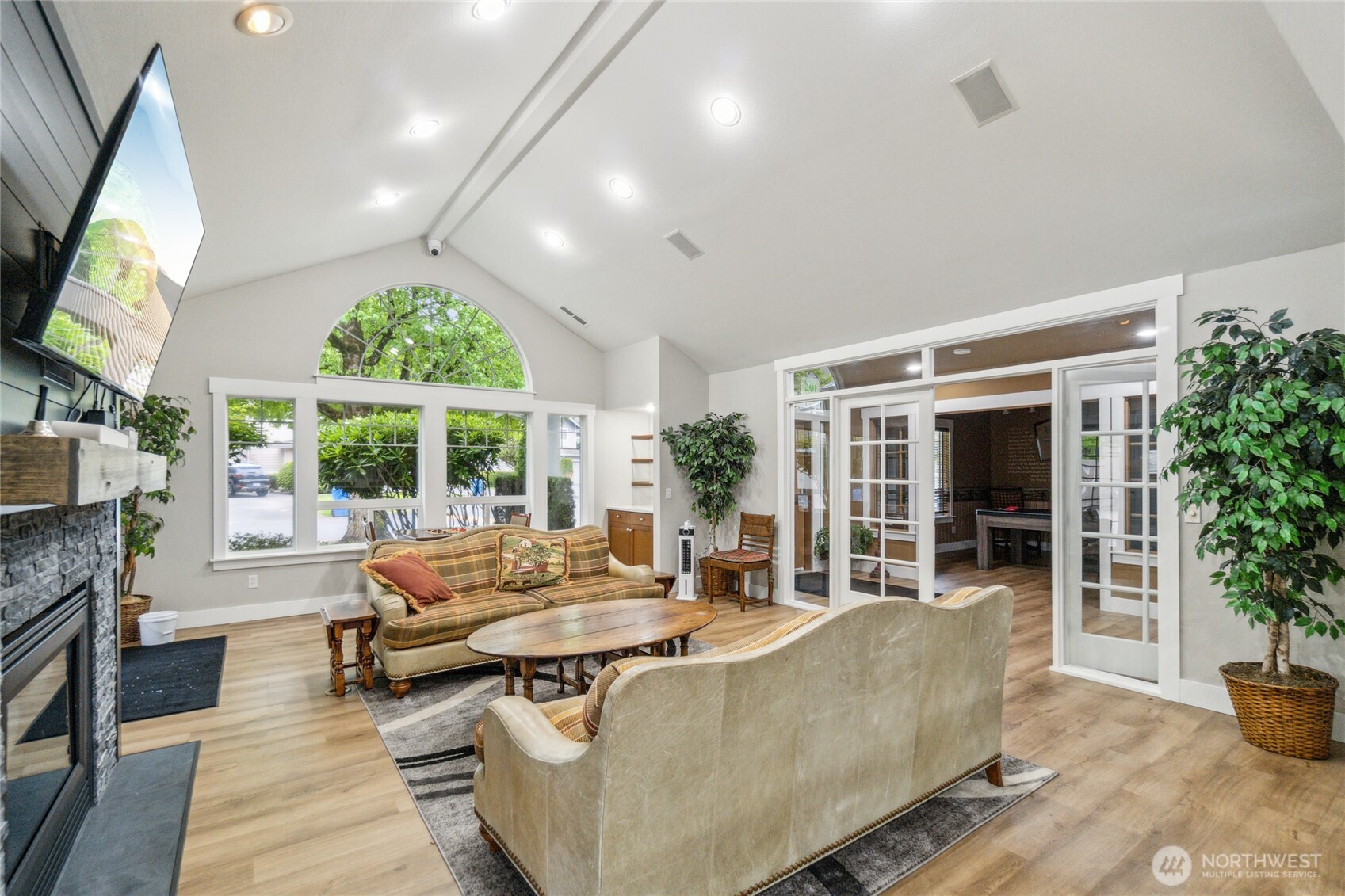 15150 140th Way Southeast, Unit T304 Renton, WA 98058 - Photo 20 of 30 a living room with furniture fireplace and large windows