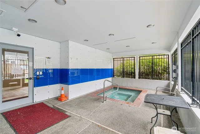 a view of a livingroom with furniture and a window