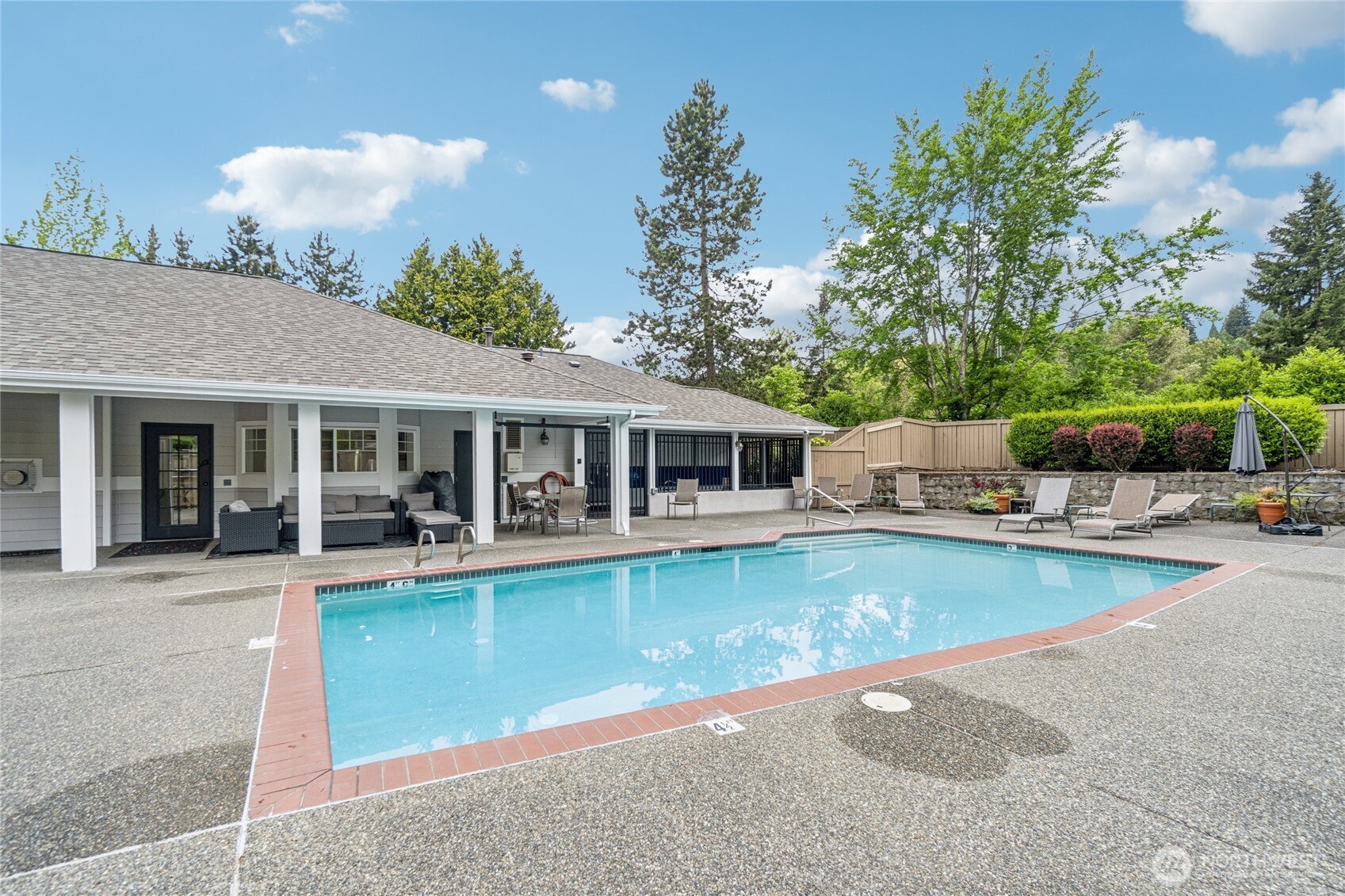 15150 140th Way Southeast, Unit T304 Renton, WA 98058 - Photo 25 of 30 a view of a house with swimming pool and sitting area