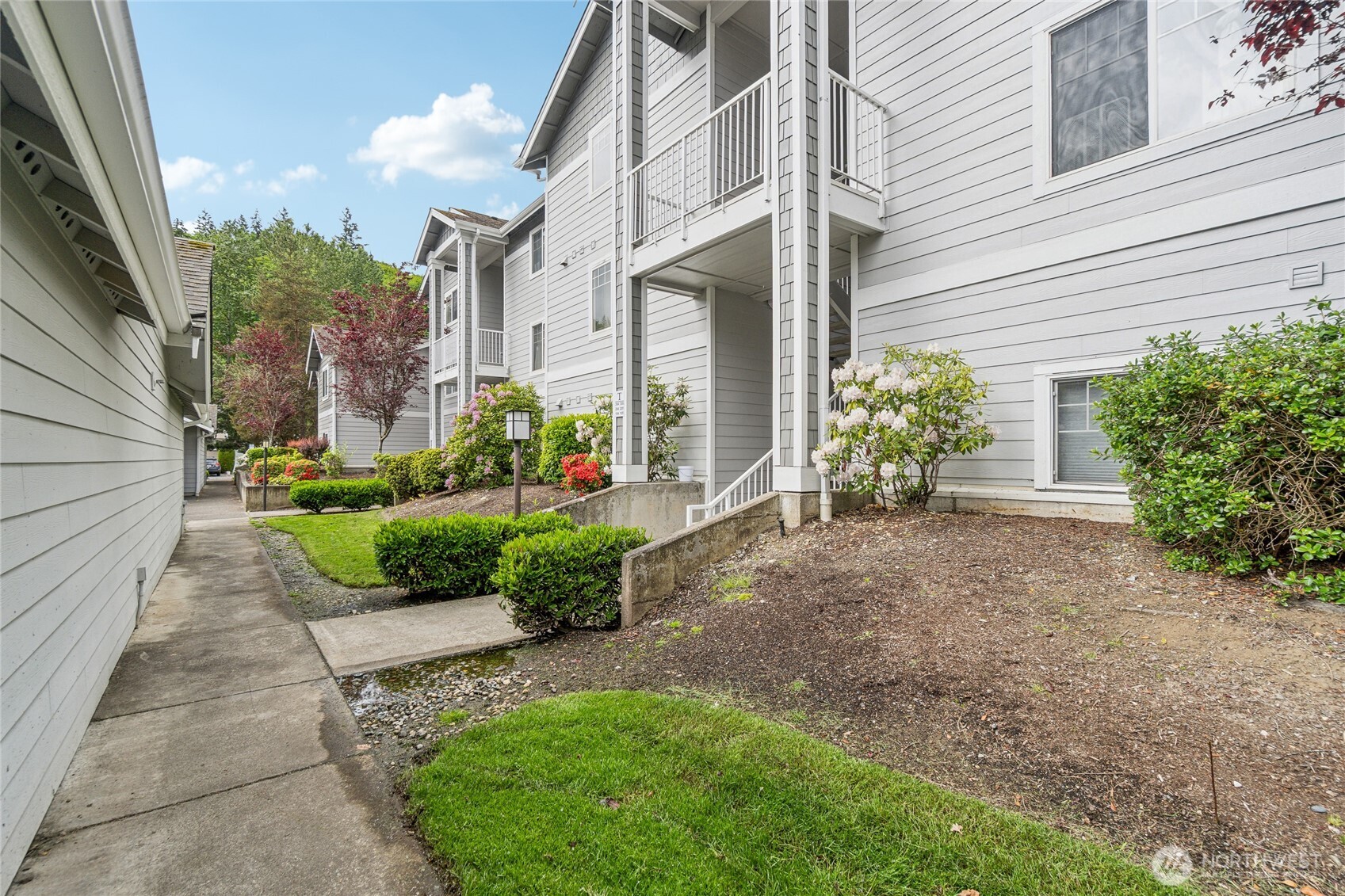 15150 140th Way Southeast, Unit T304 Renton, WA 98058 - Photo 28 of 30 a view of a back yard of the house