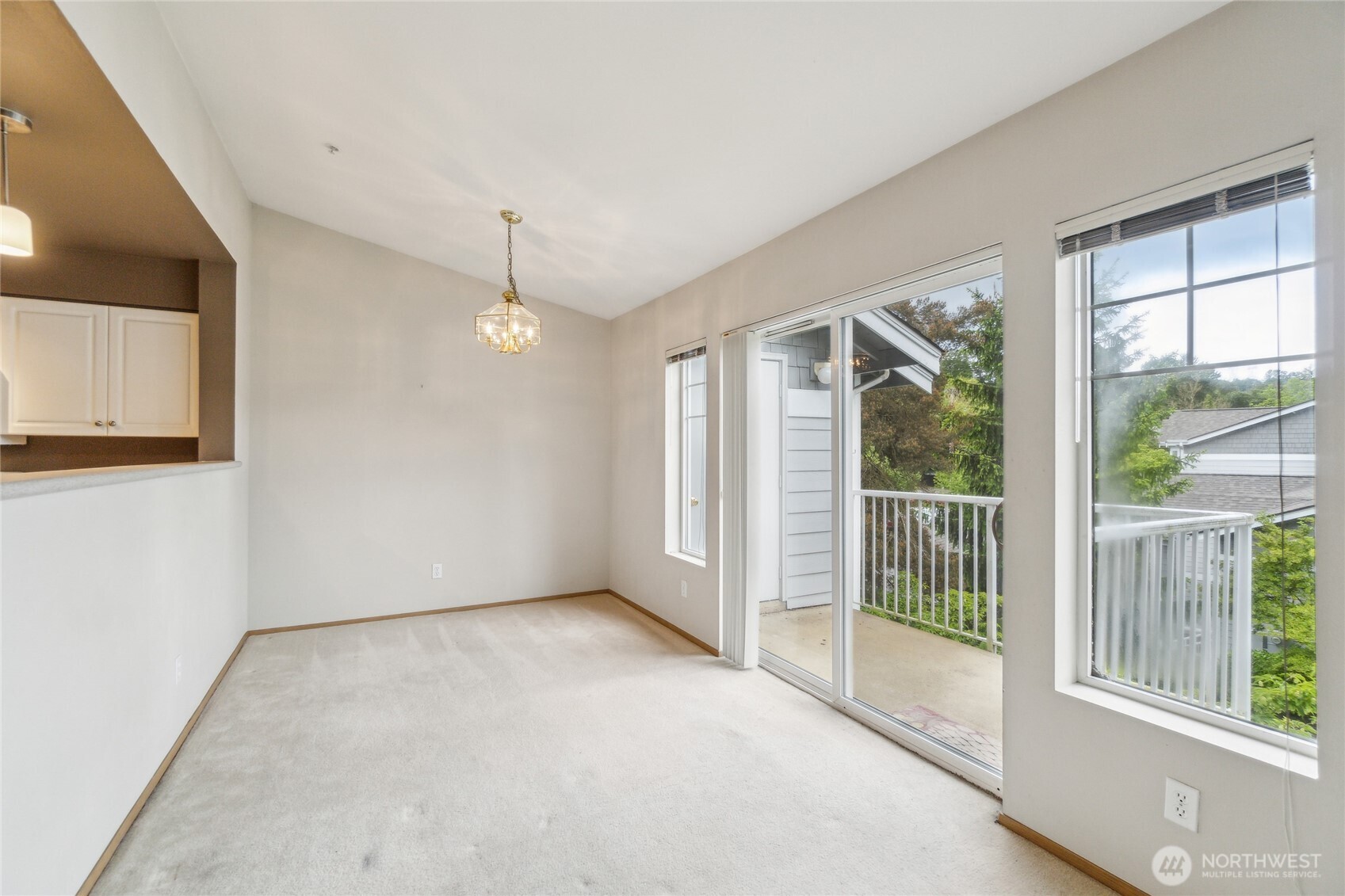 15150 140th Way Southeast, Unit T304 Renton, WA 98058 - Photo 7 of 30 a view of a room with large windows