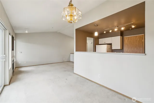a view of a hallway with a chandelier