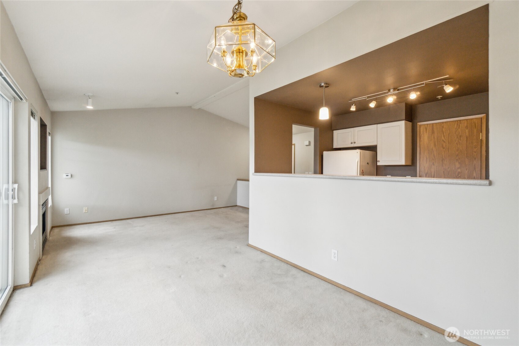 15150 140th Way Southeast, Unit T304 Renton, WA 98058 - Photo 8 of 30 a view of a hallway with a chandelier