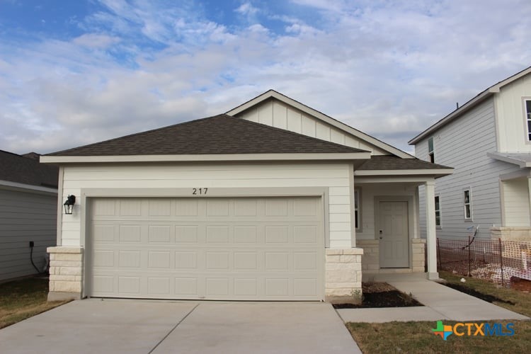 217 Escape Way Jarrell, TX 76537 - Photo 1 of 1 a front view of a house with garage
