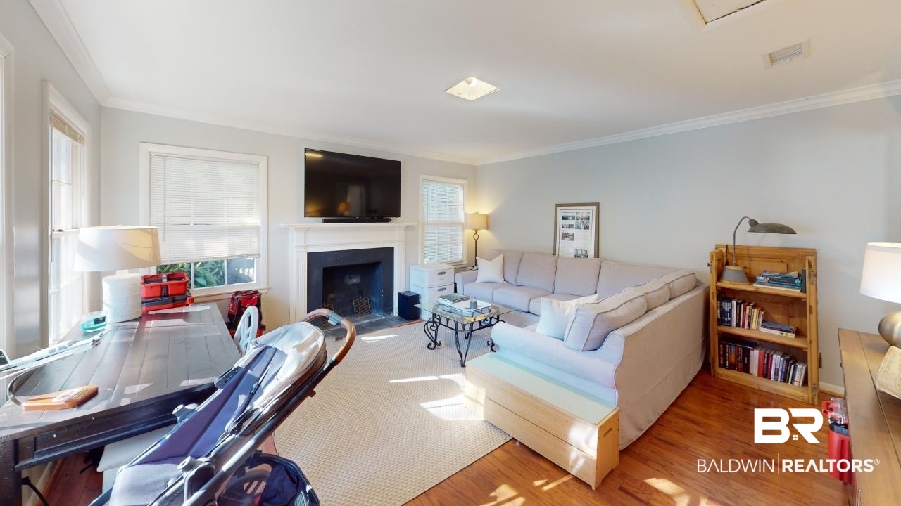 4358 Stein Street Mobile, AL 36608 - Photo 24 of 29 Living room with crown molding and light hardwood / wood-style floors