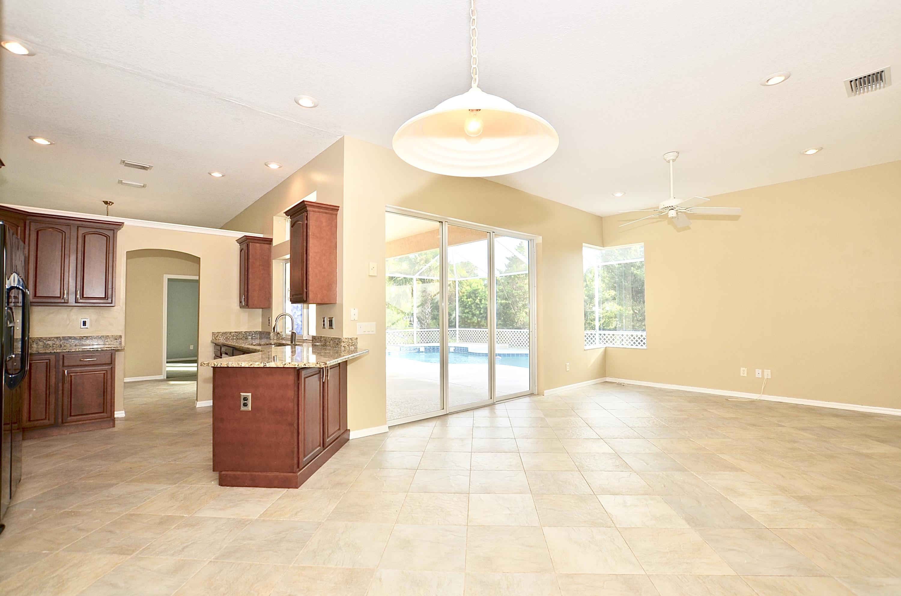 331 Southeast Fisk Road Port St. Lucie, FL 34984 - Photo 10 of 28 Family Rm to kitchen