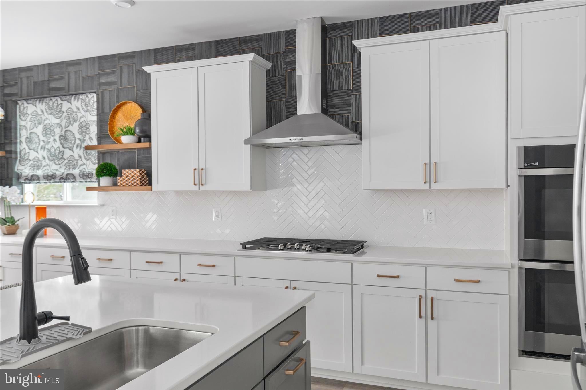 174 Williamson Road Winchester, VA 22602 - Photo 12 of 67 a kitchen with stainless steel appliances granite countertop a sink a stove and refrigerator