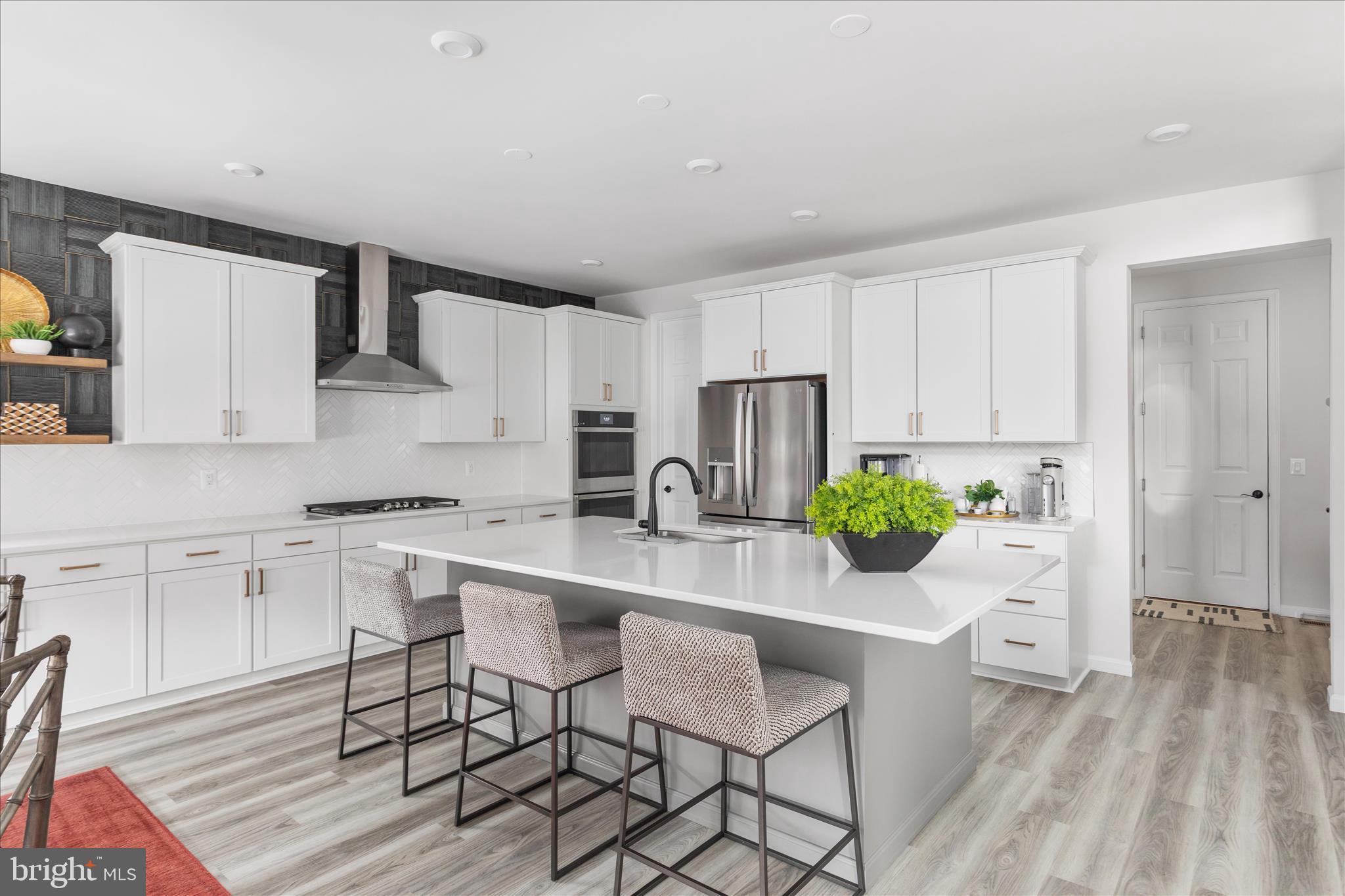 174 Williamson Road Winchester, VA 22602 - Photo 13 of 67 a kitchen with white cabinets and stainless steel appliances