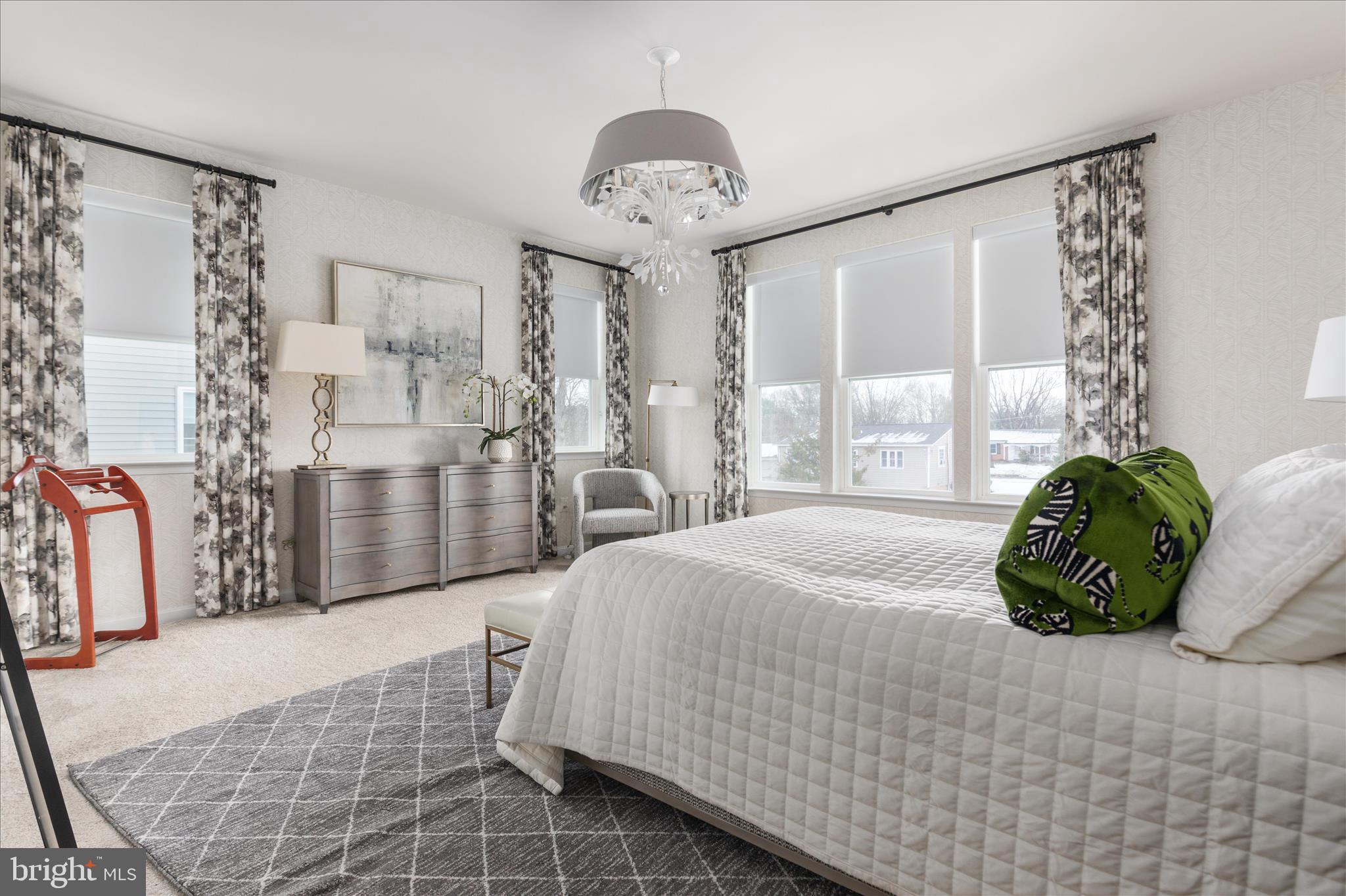 174 Williamson Road Winchester, VA 22602 - Photo 19 of 67 a bedroom with a bed and a chandelier