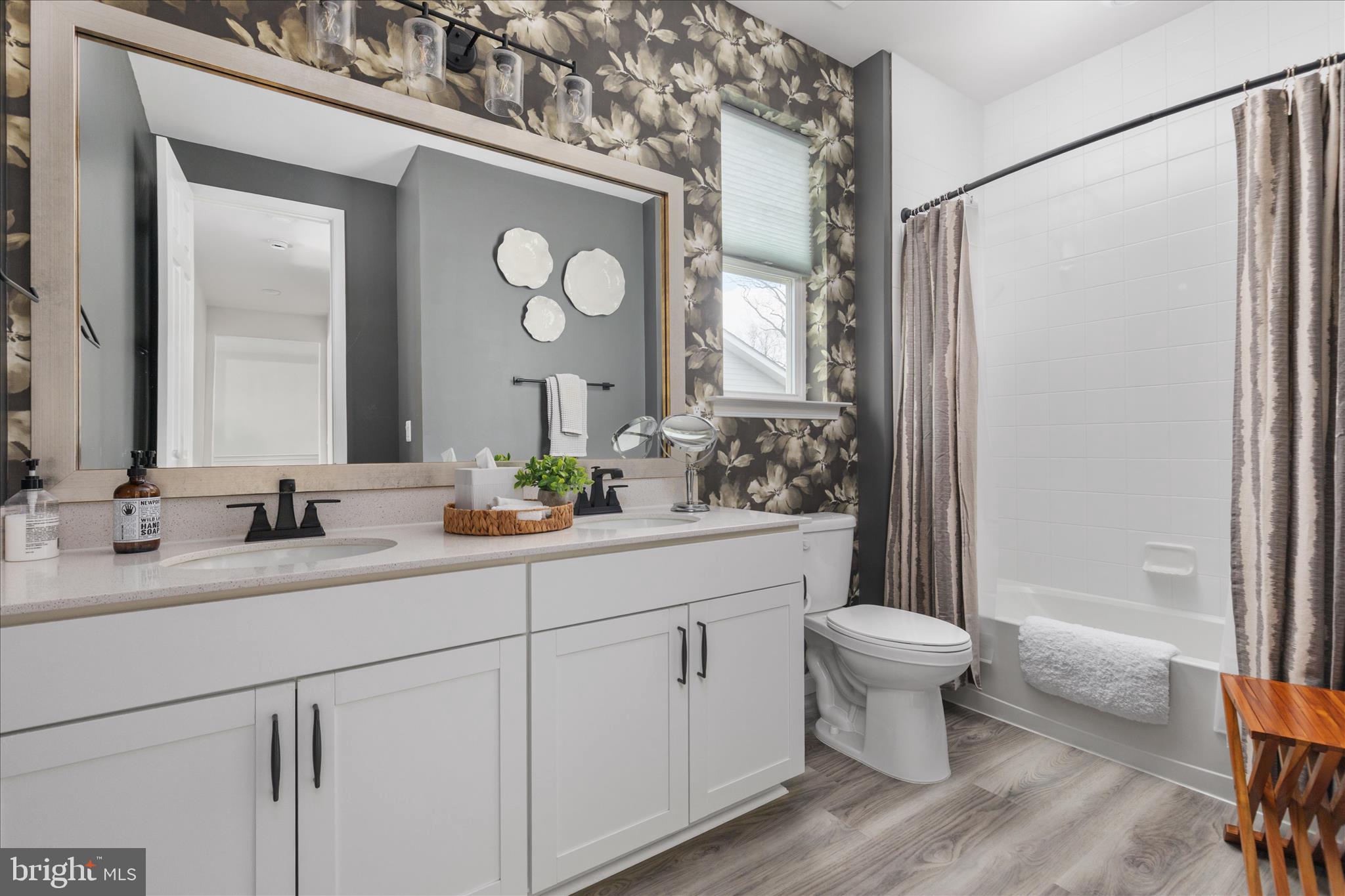 174 Williamson Road Winchester, VA 22602 - Photo 25 of 67 a bathroom with a double vanity sink mirror and toilet