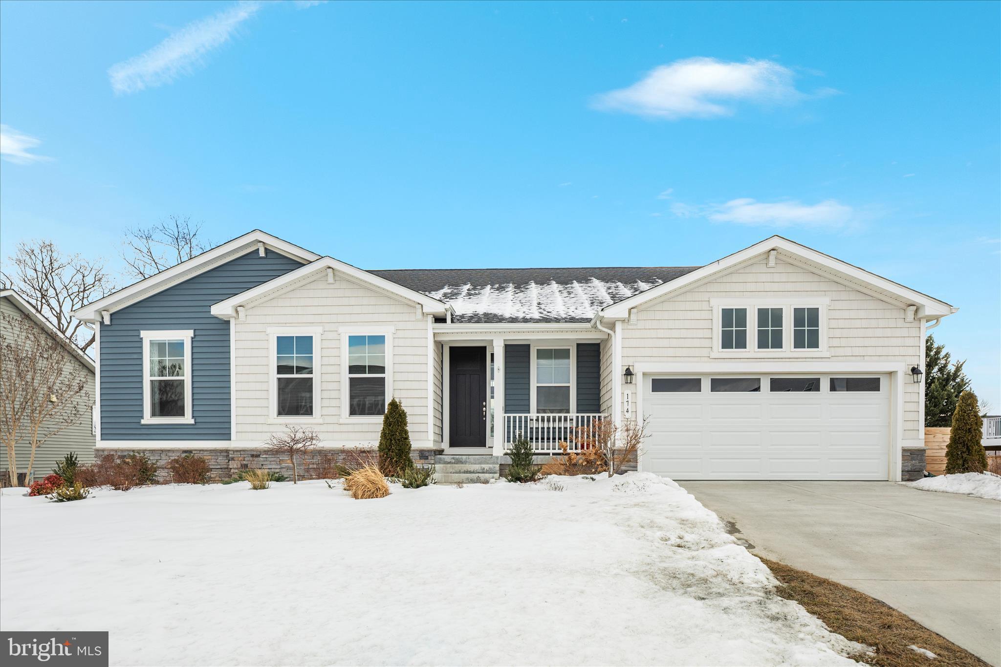 174 Williamson Road Winchester, VA 22602 - Photo 45 of 67 a front view of a house with a yard and garage