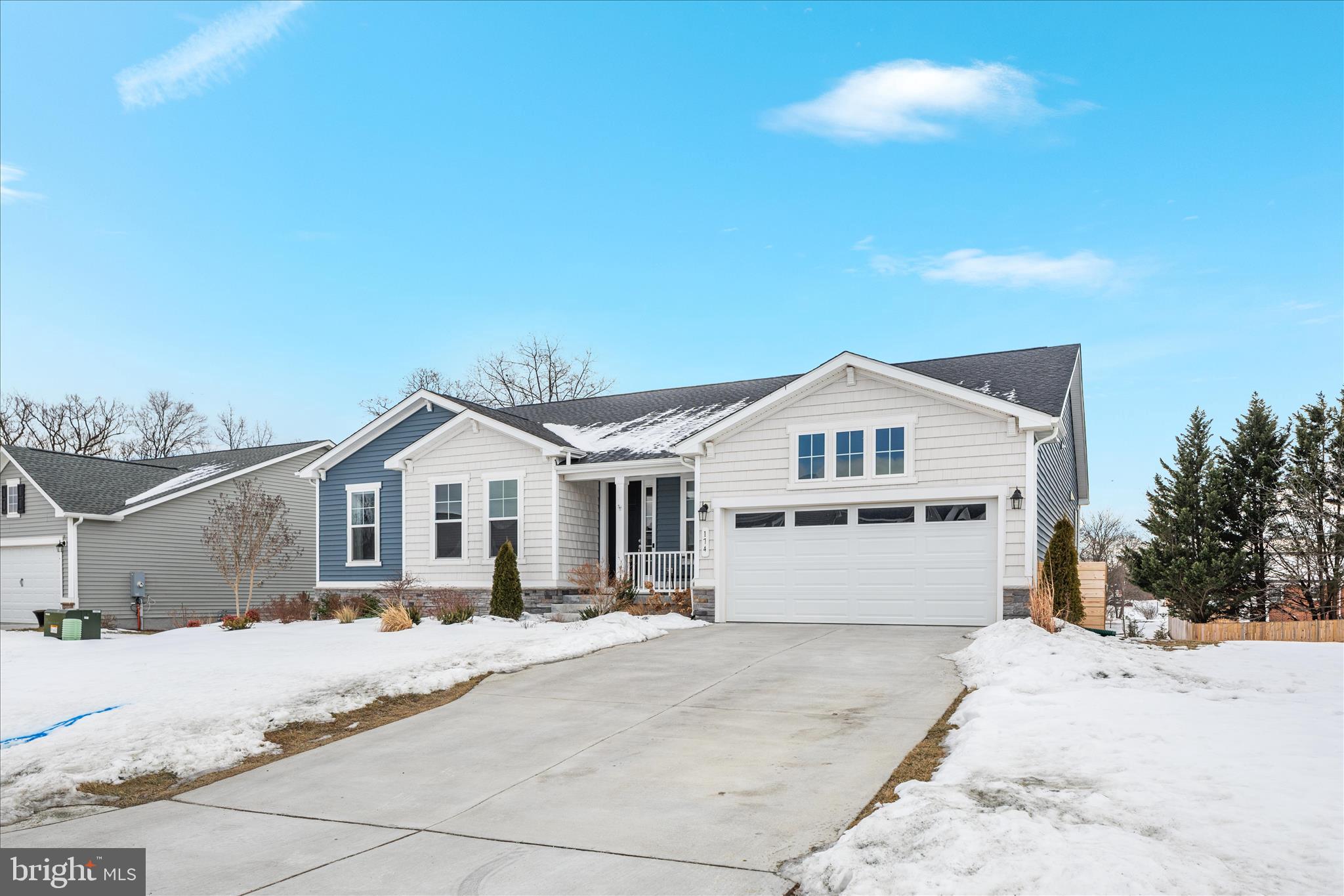 174 Williamson Road Winchester, VA 22602 - Photo 46 of 67 a front view of a house with a yard and garage
