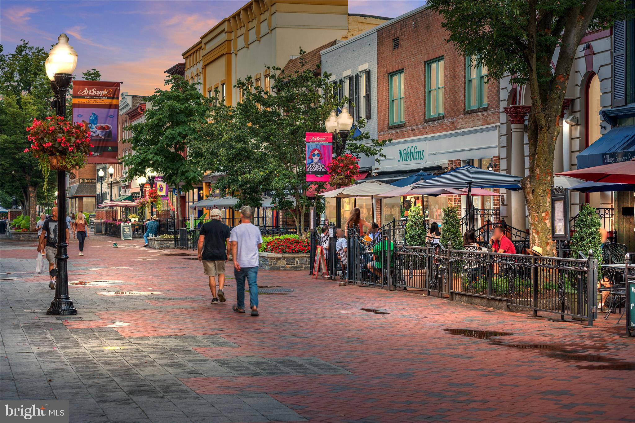 174 Williamson Road Winchester, VA 22602 - Photo 58 of 67 a front view of a multi story building with retail shops