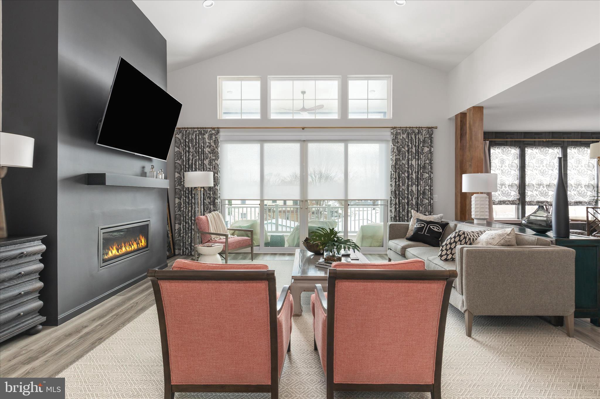 174 Williamson Road Winchester, VA 22602 - Photo 9 of 67 a living room with fireplace furniture and a flat screen tv