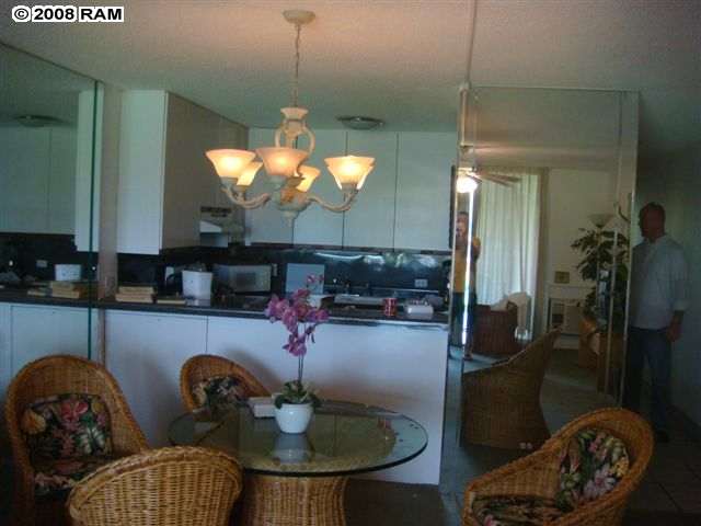 2695 South Kihei Road, Unit 10103 Kihei, HI 96753 - Photo 7 of 8 a kitchen with a table and chairs