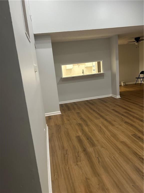 1230 Hanover Place Alpharetta, GA 30009 - Photo 13 of 29 a view of an empty room with wooden floor and a window