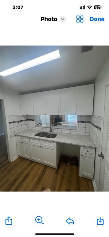 1230 Hanover Place Alpharetta, GA 30009 - Photo 16 of 29 a kitchen with a sink and a refrigerator