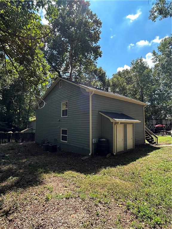 1230 Hanover Place Alpharetta, GA 30009 - Photo 24 of 29 a house with trees in the background