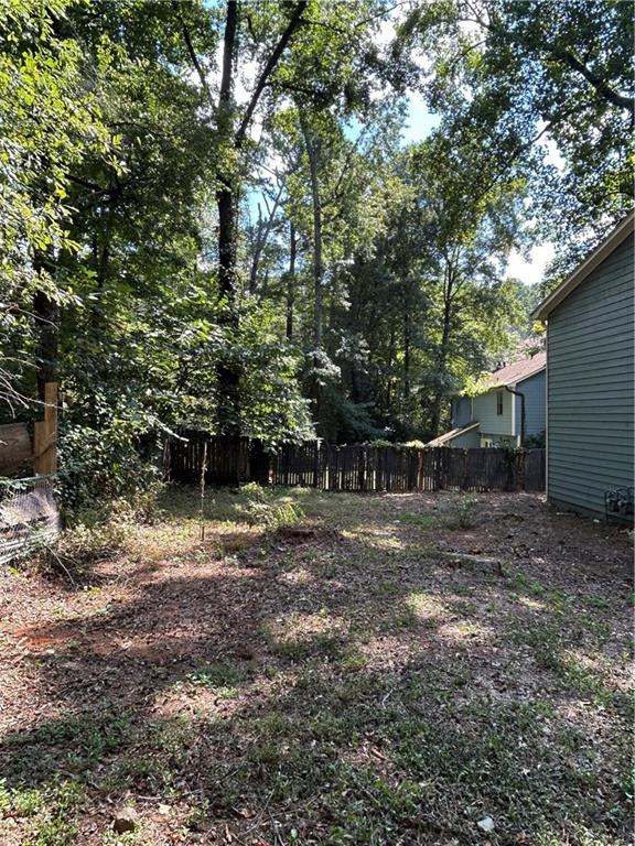 1230 Hanover Place Alpharetta, GA 30009 - Photo 27 of 29 a backyard of a house with lots of green space