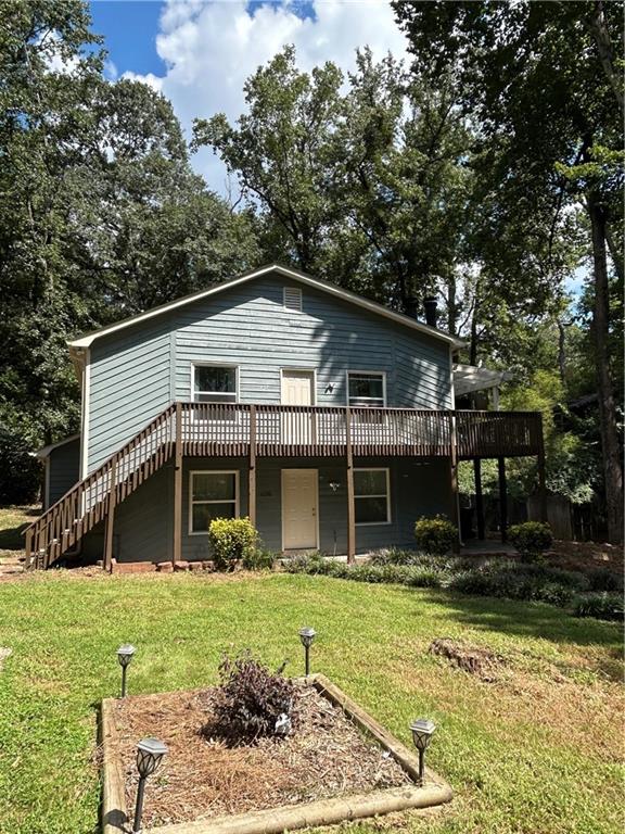 1230 Hanover Place Alpharetta, GA 30009 - Photo 5 of 29 a front view of a house with garden