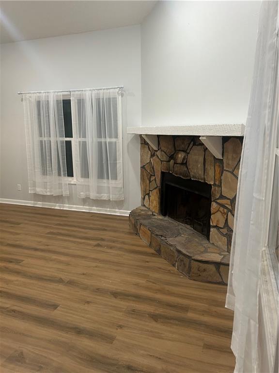 1230 Hanover Place Alpharetta, GA 30009 - Photo 7 of 29 a view of a livingroom with wooden floor and a fireplace