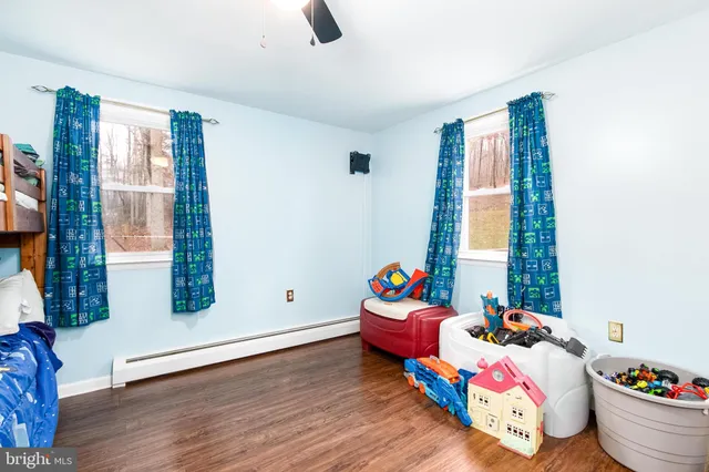 a bedroom with bed and a window